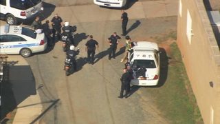 channel 9 is asking why the person is in custody and if police are searching for anyone else