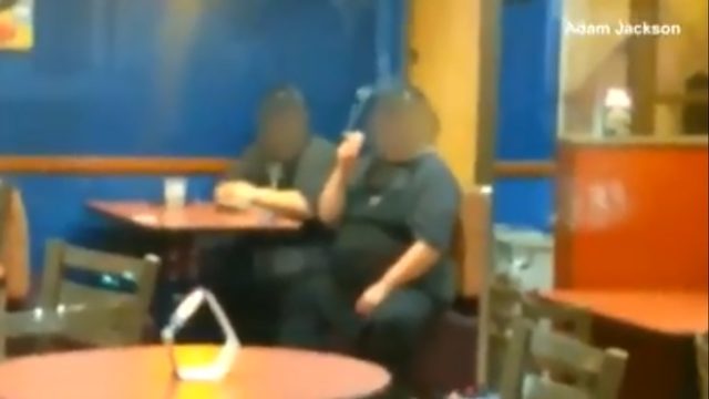 TACO BELL SMOKERS: Taco Bell workers appear to smoke inside, line of cars grows outside
